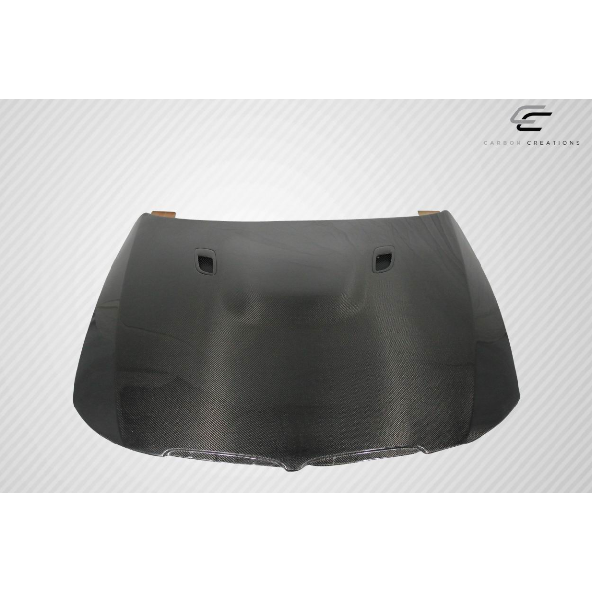 Modify your BMW 3-Series 2006 with our Exterior/Hoods - Top view of carbon fiber hood at a straight angle