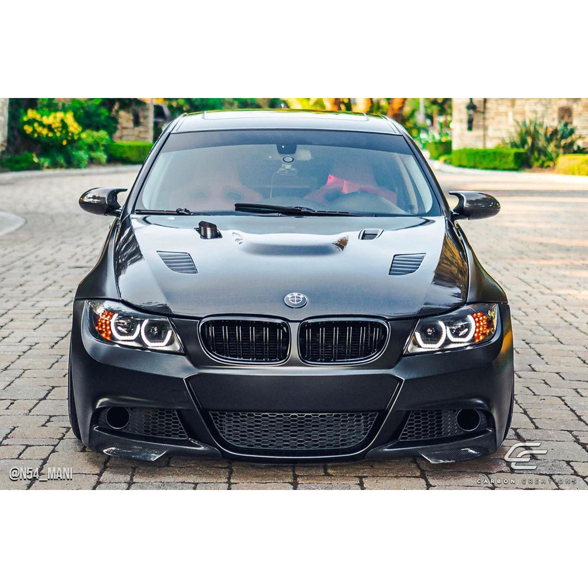 Modify your BMW 3-Series 2009 with our Exterior/Hoods - Front view of vehicle showing hood angle