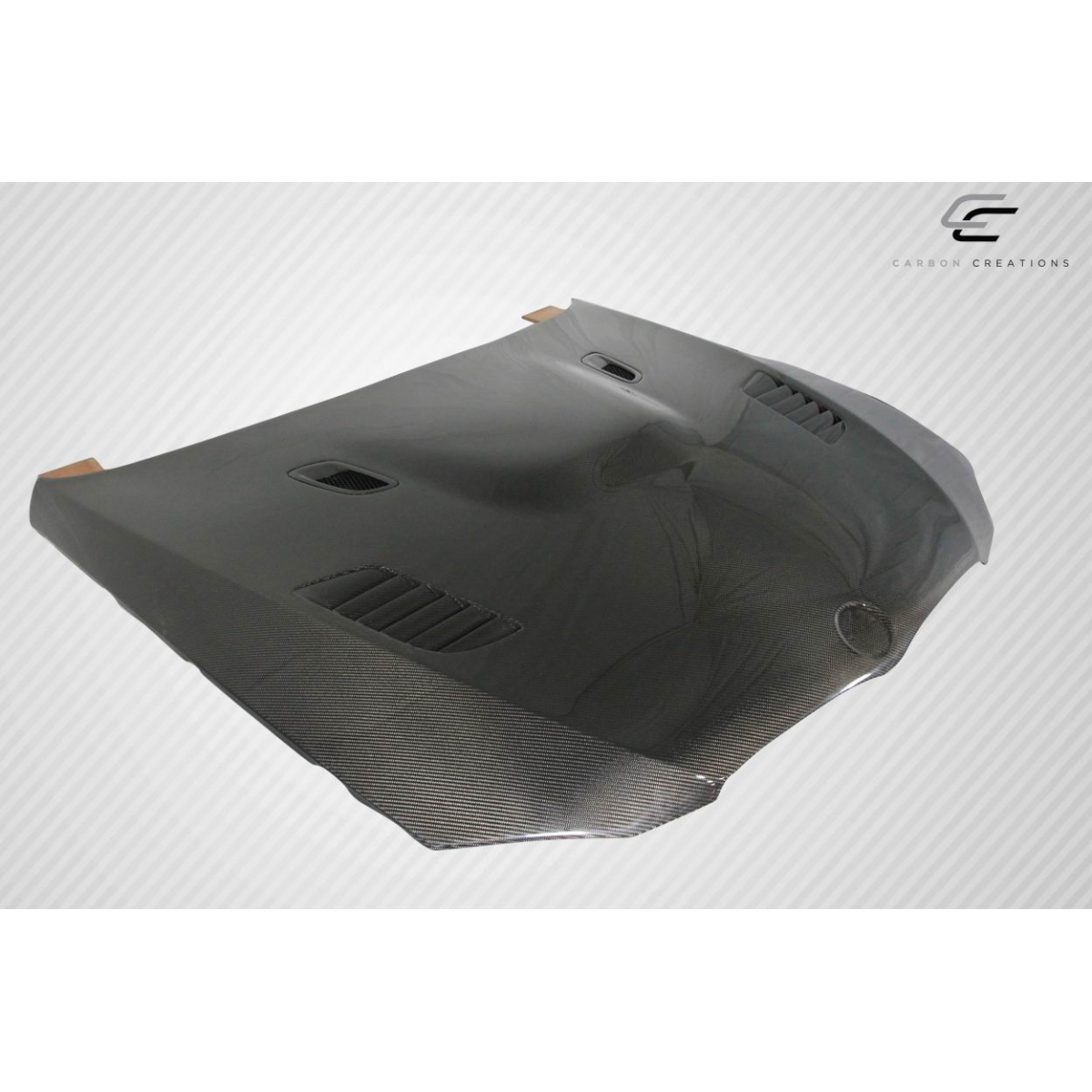 Modify your BMW M3 2008 with our Exterior/Hoods - Angled view showing carbon fiber hood from above