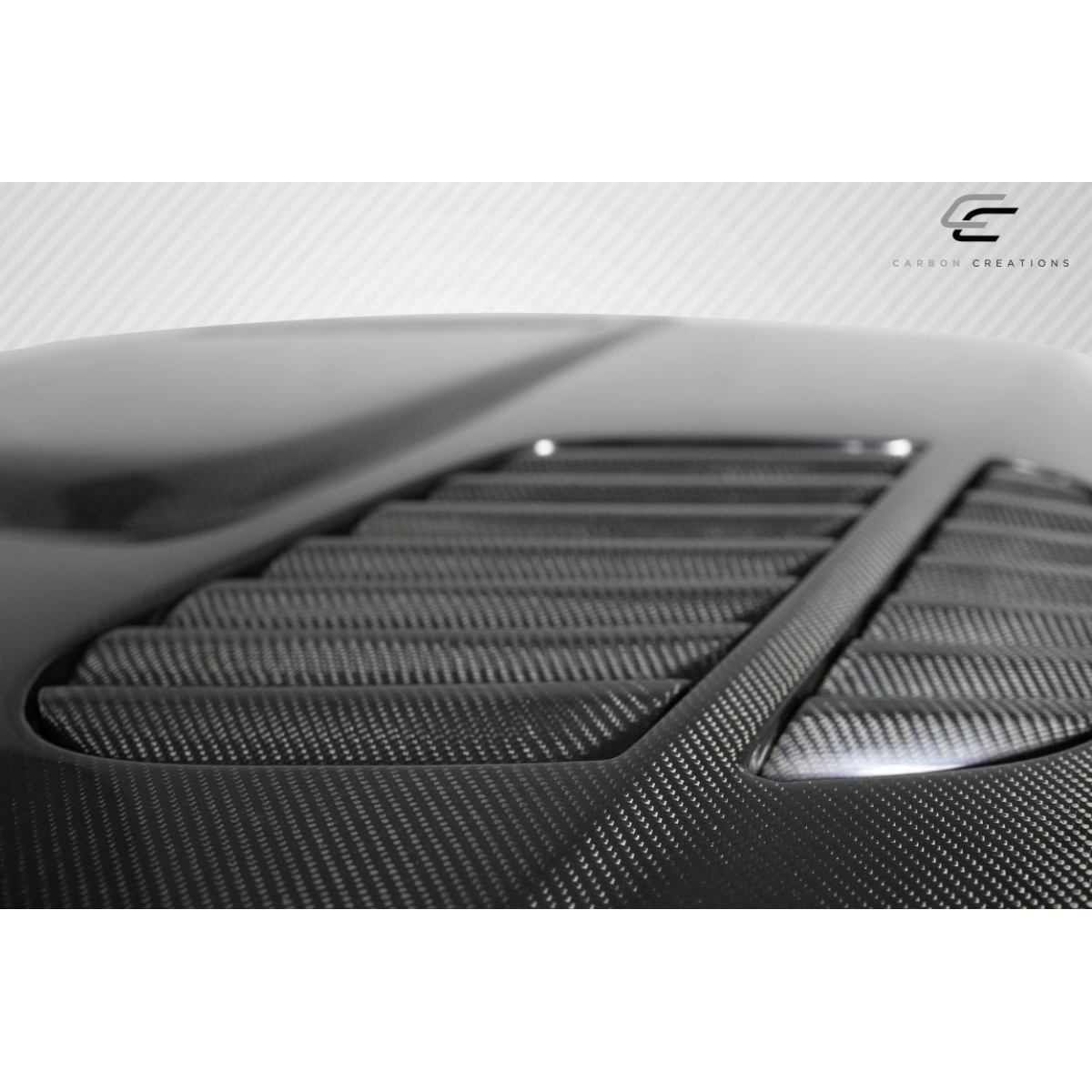 Modify your BMW 3-Series 2004 with our Exterior/Hoods - Top angle view of carbon fiber hood panel