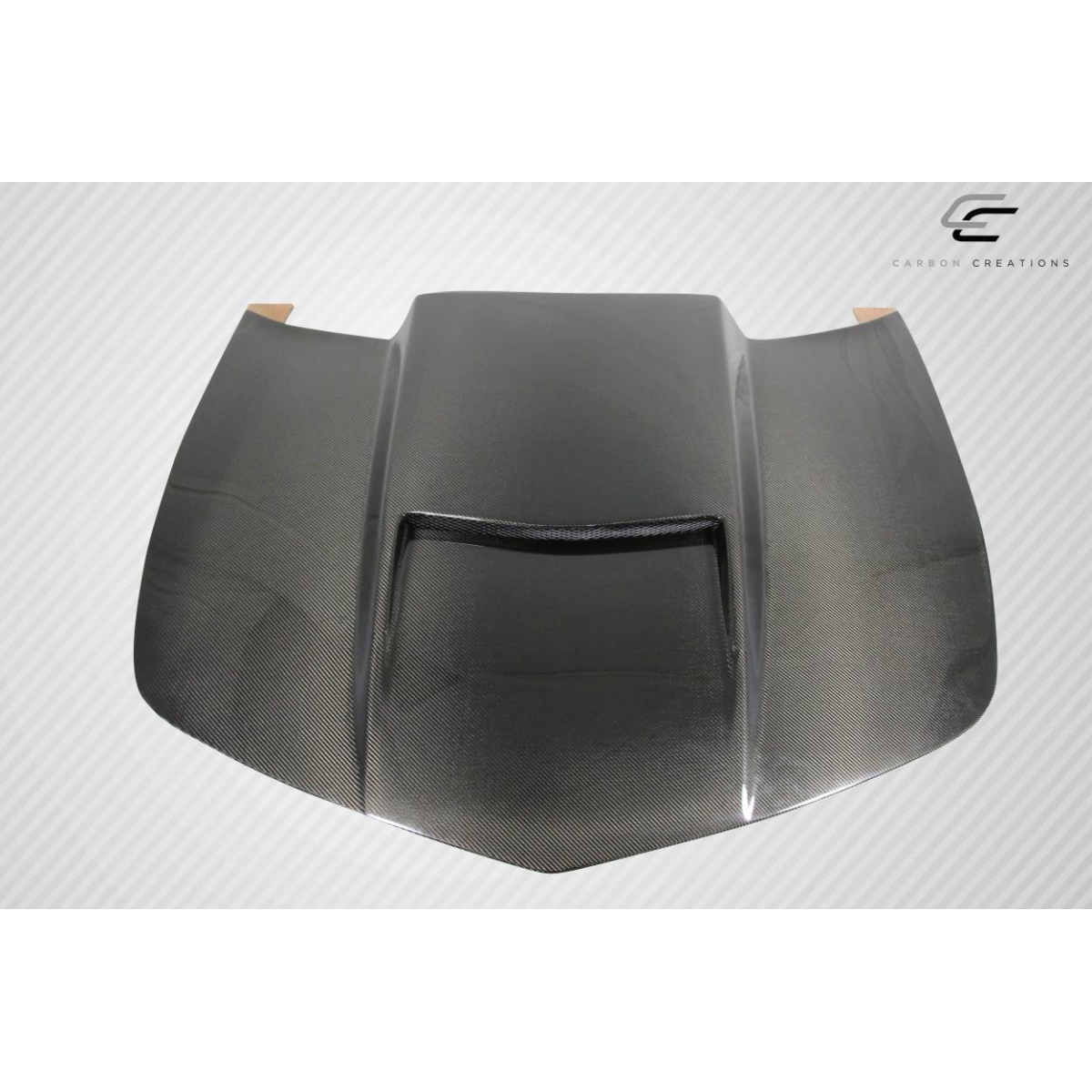 Modify your Chevrolet Camaro 2010 with our Exterior/Hoods - Angled view of carbon fiber hood