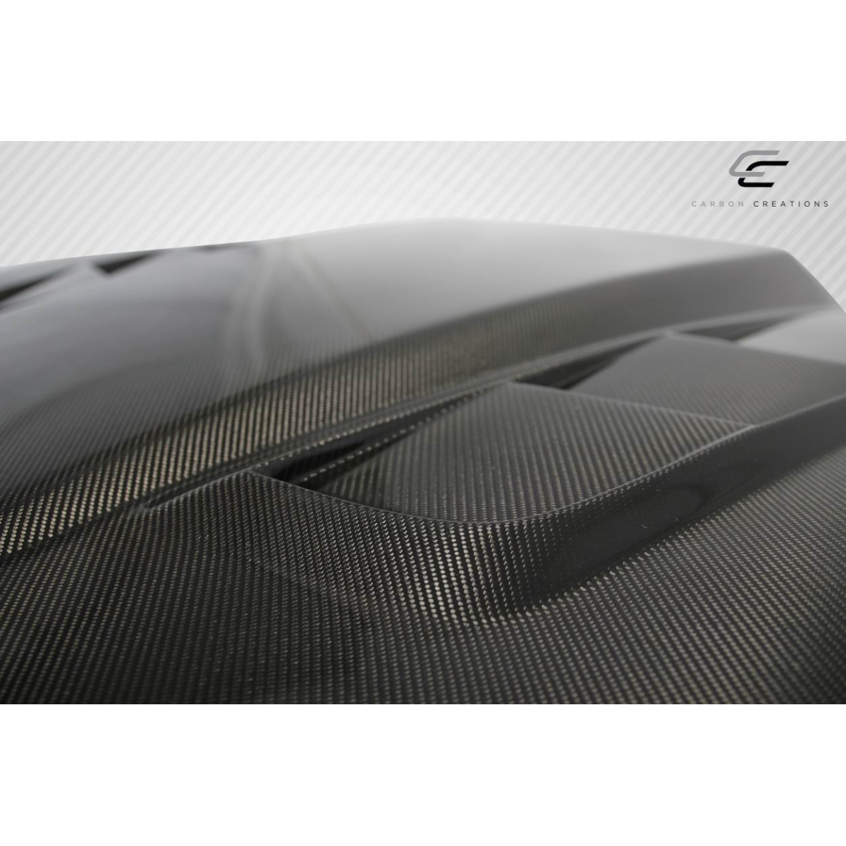 Modify your Chevrolet Corvette 1997 with our Exterior/Hoods - Angled view showing carbon fiber texture and design