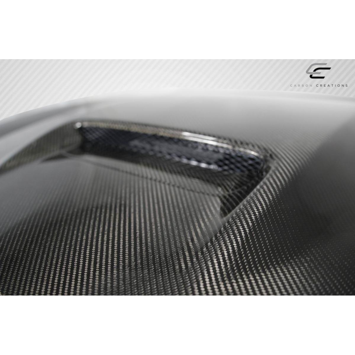 Modify your Dodge Charger 2011 with our Exterior/Hoods - Angled view of carbon fiber hood surface