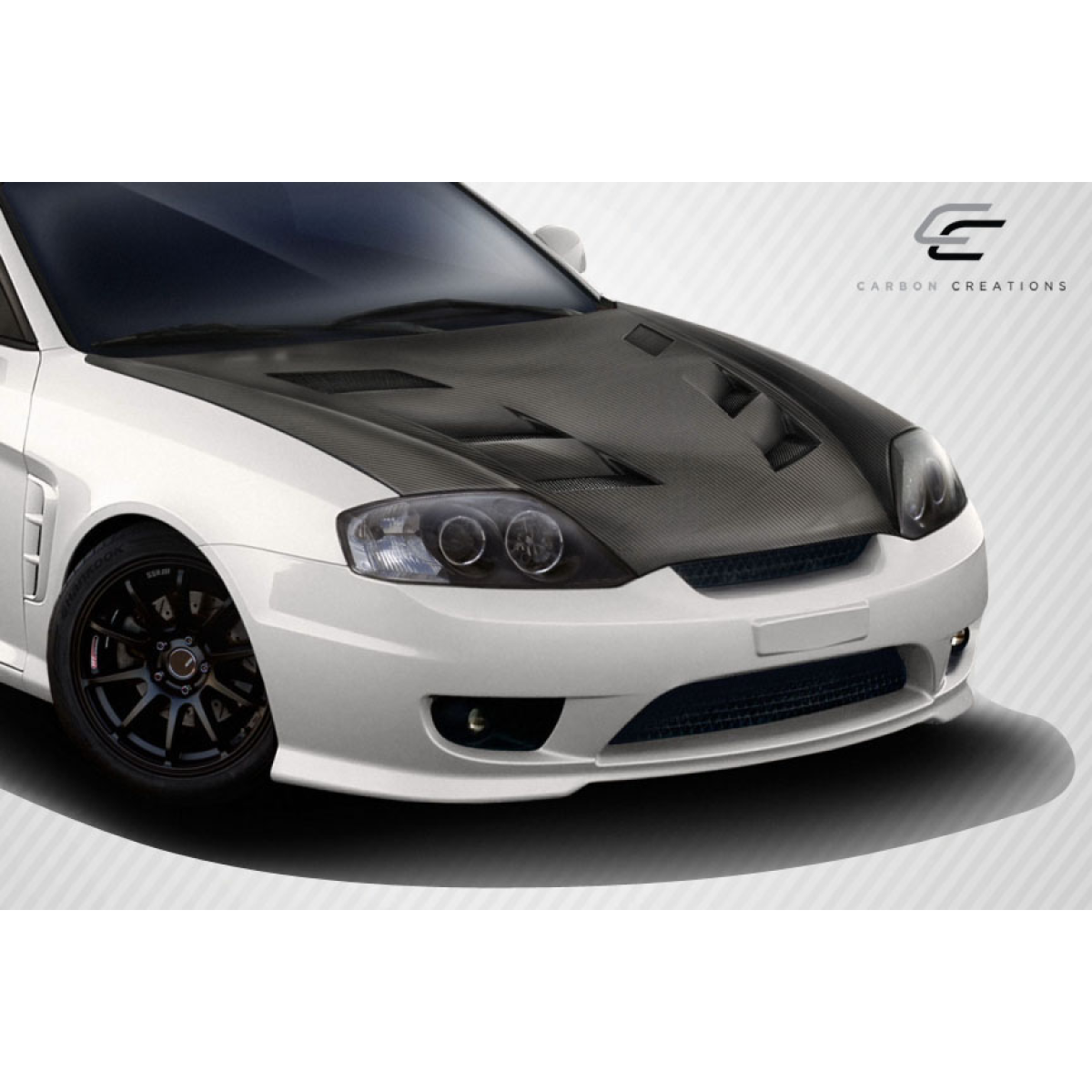 Modify your Hyundai Tiburon 2003 with our Exterior/Hoods - Angled view of vehicle hood from the front
