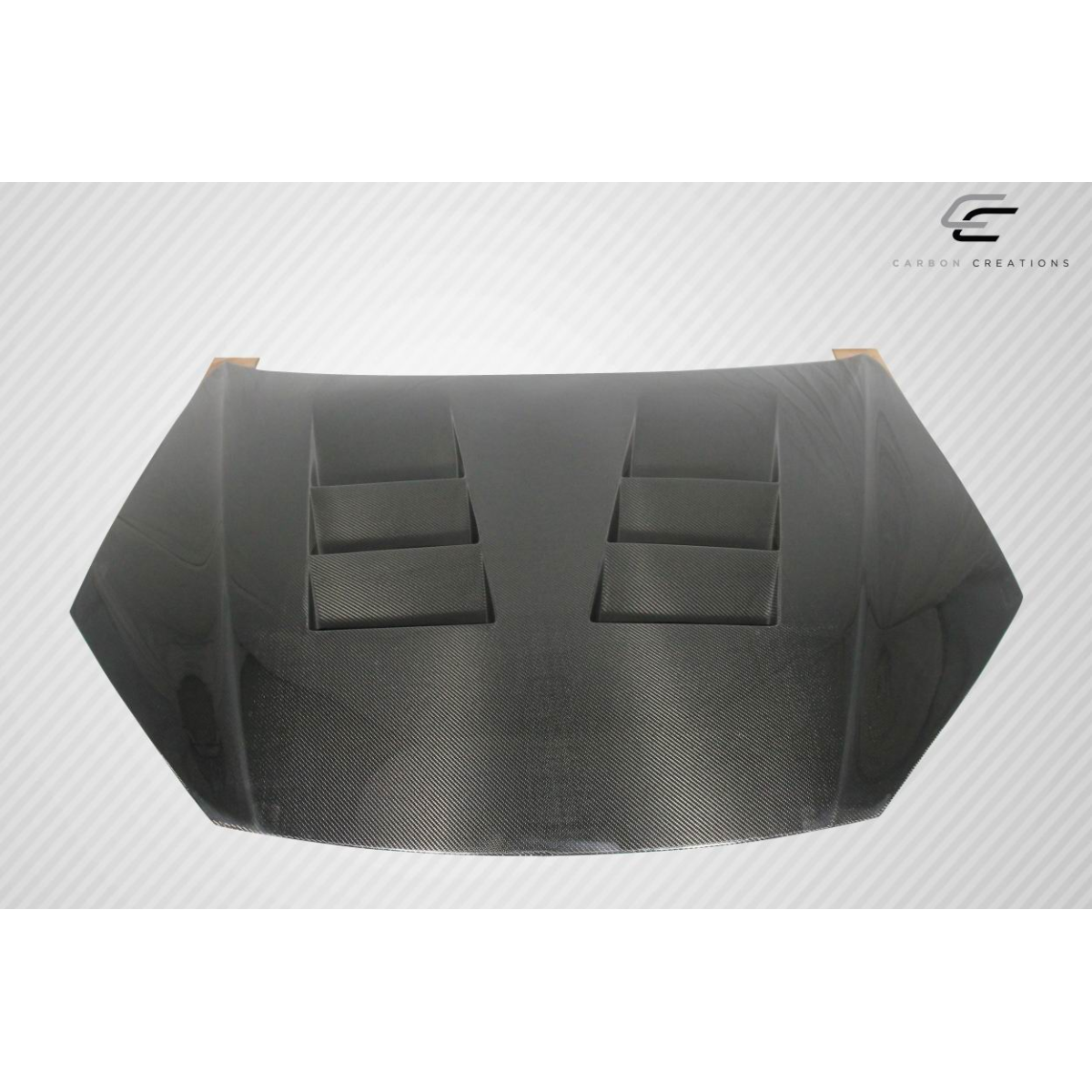 Modify your Hyundai Genesis 2013 with our Exterior/Hoods - Front view of carbon fiber hood at a slight angle