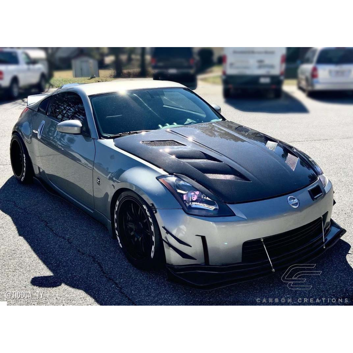 Modify your Nissan 350Z 2003 with our Exterior/Hoods - Front angle showing hood and body details