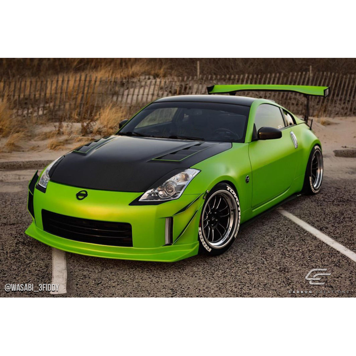 Modify your Nissan 350Z 2003 with our Exterior/Hoods - Front angle showcasing modified Nissan 350Z