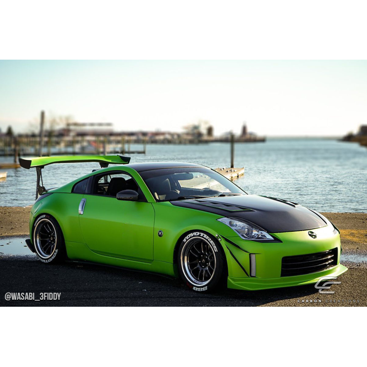 Modify your Nissan 350Z 2003 with our Exterior/Hoods - The image shows the vehicle in a side angle view