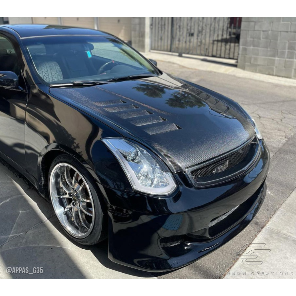 Modify your Infiniti G35 2003 with our Exterior/Hoods - Front angle showing carbon fiber hood detail