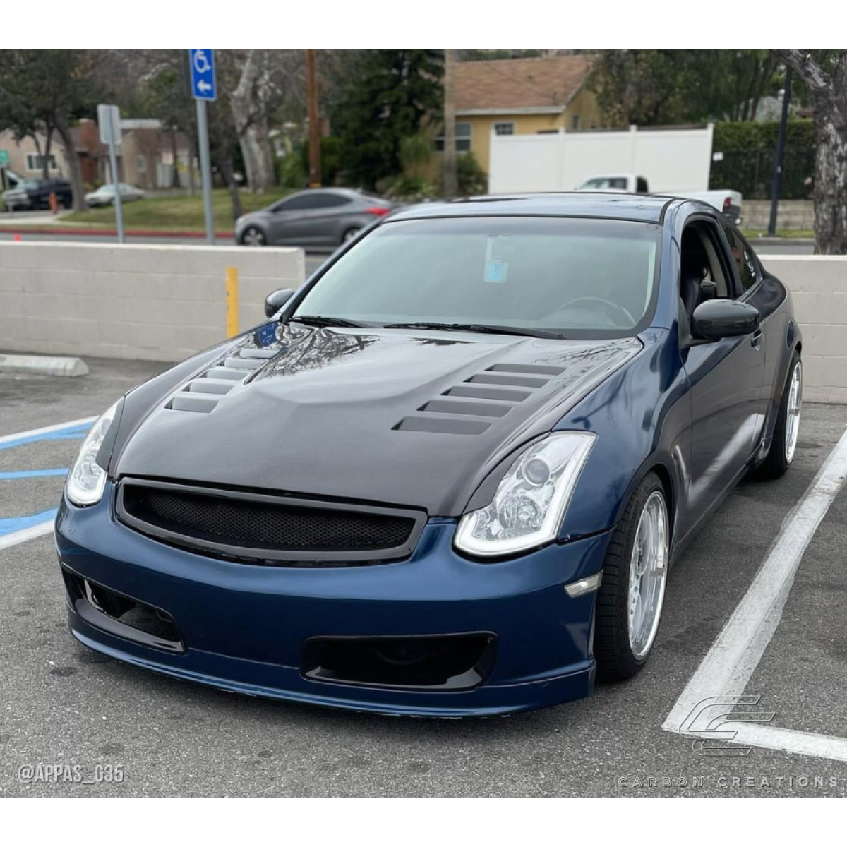 Modify your Infiniti G35 2003 with our Exterior/Hoods - Front angle view of the Infiniti G35 with hood