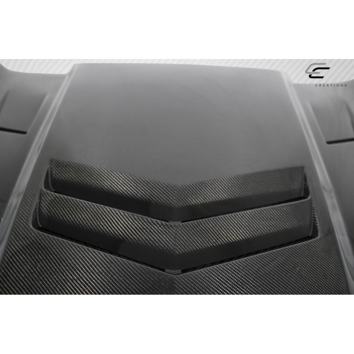 Modify your Cadillac ATS 2012 with our Exterior/Hoods - Parts viewed from top angle showcasing carbon fiber