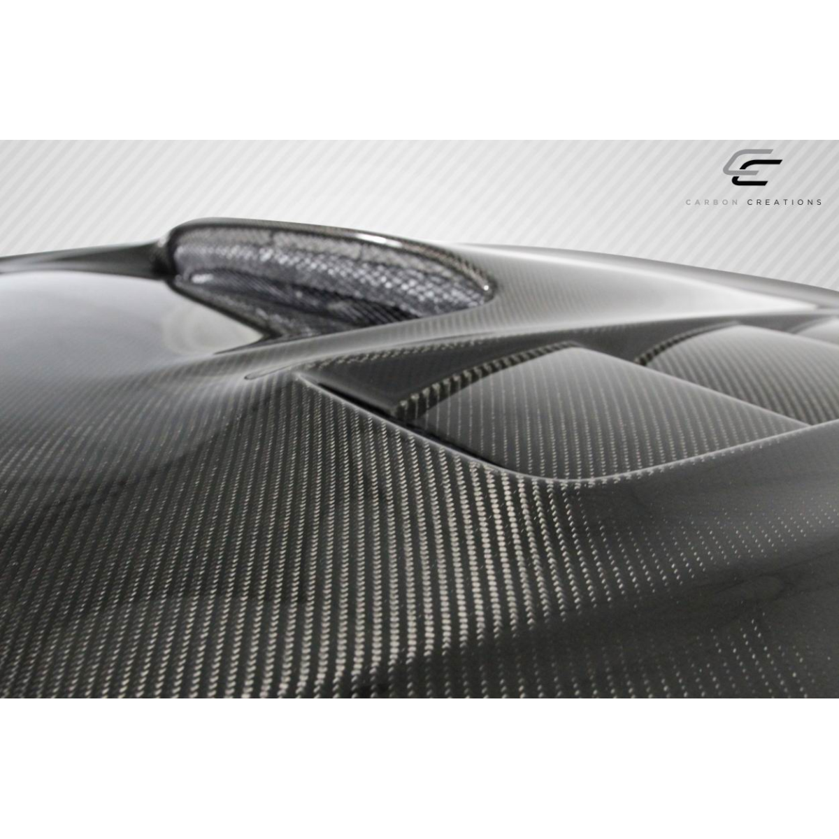 Modify your Subaru Impreza 2008 with our Exterior/Hoods - Angled close-up of carbon fiber hood surface