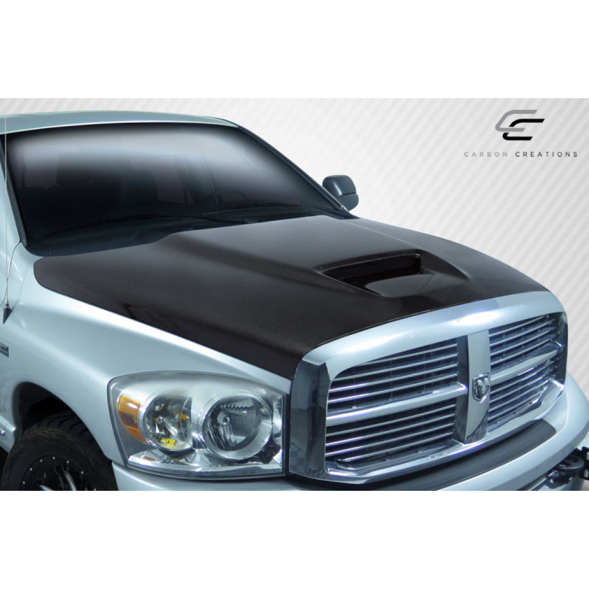 Modify your Dodge Ram 2002 with our Exterior/Hoods - Front angle view of carbon fiber hood