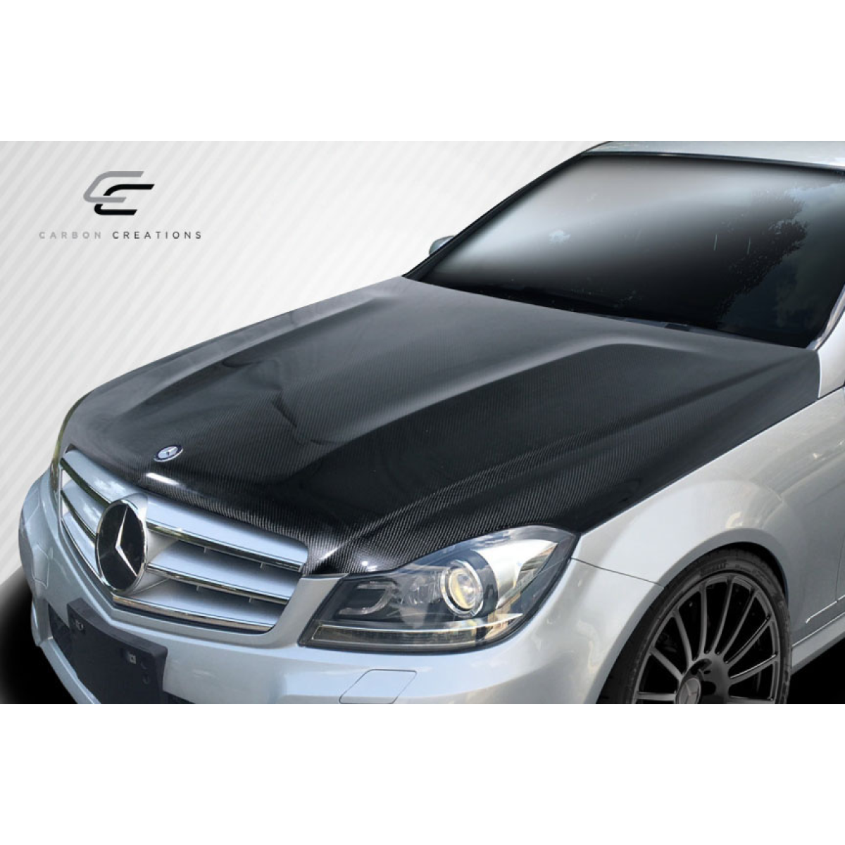 Modify your Mercedes-Benz C300 2012 with our Exterior/Hoods - Front view of the vehicle hood at a slight angle