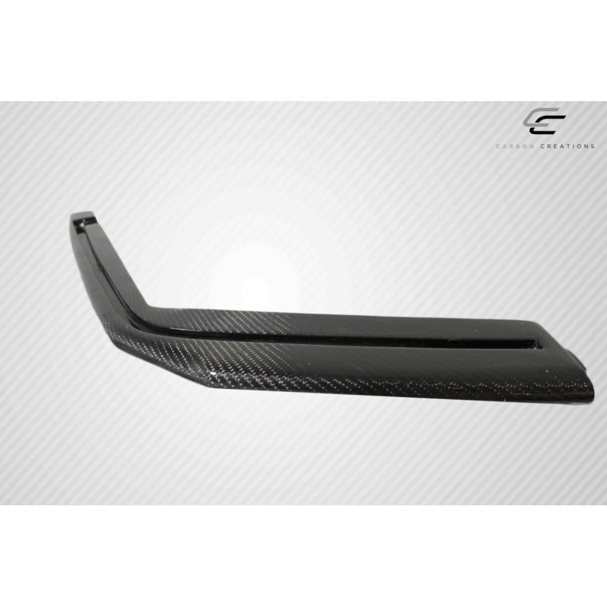 Modify your Cadillac CTS 2009 with our Exterior/Other Exterior - Angled view of a carbon fiber front splitter