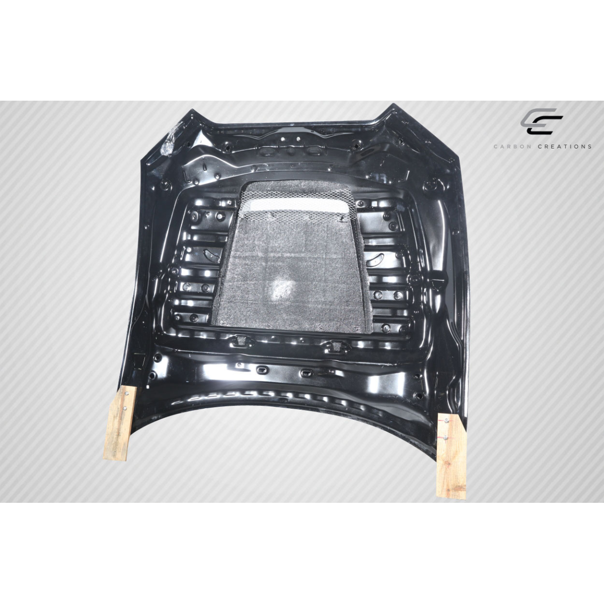 Modify your Mazda Miata 2016 with our Exterior/Hoods - Flat view of carbon fiber hood part at top down angle