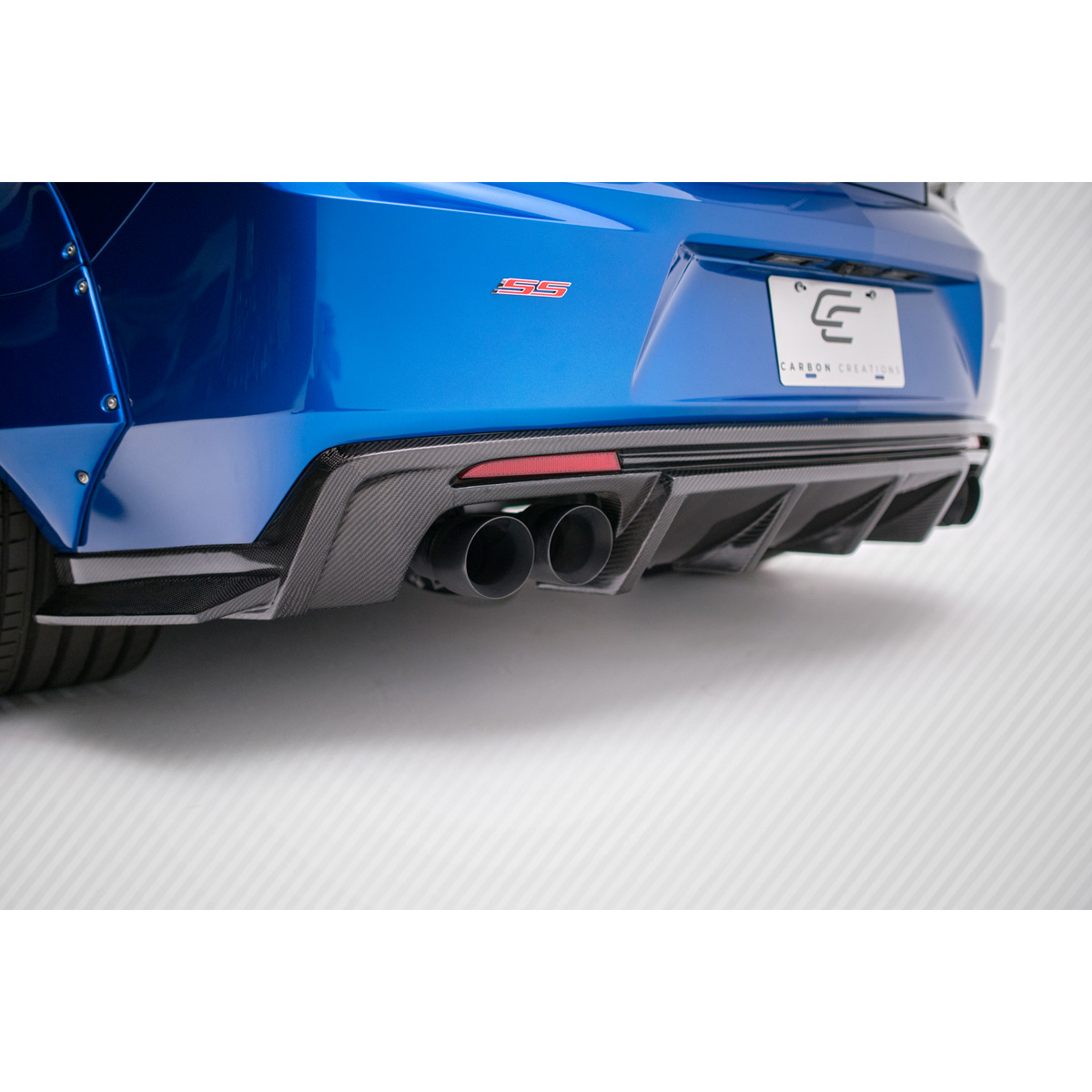 Modify your Chevrolet Camaro 2016 with our Exterior/Diffusers - Rear view low angle of a carbon fiber diffuser