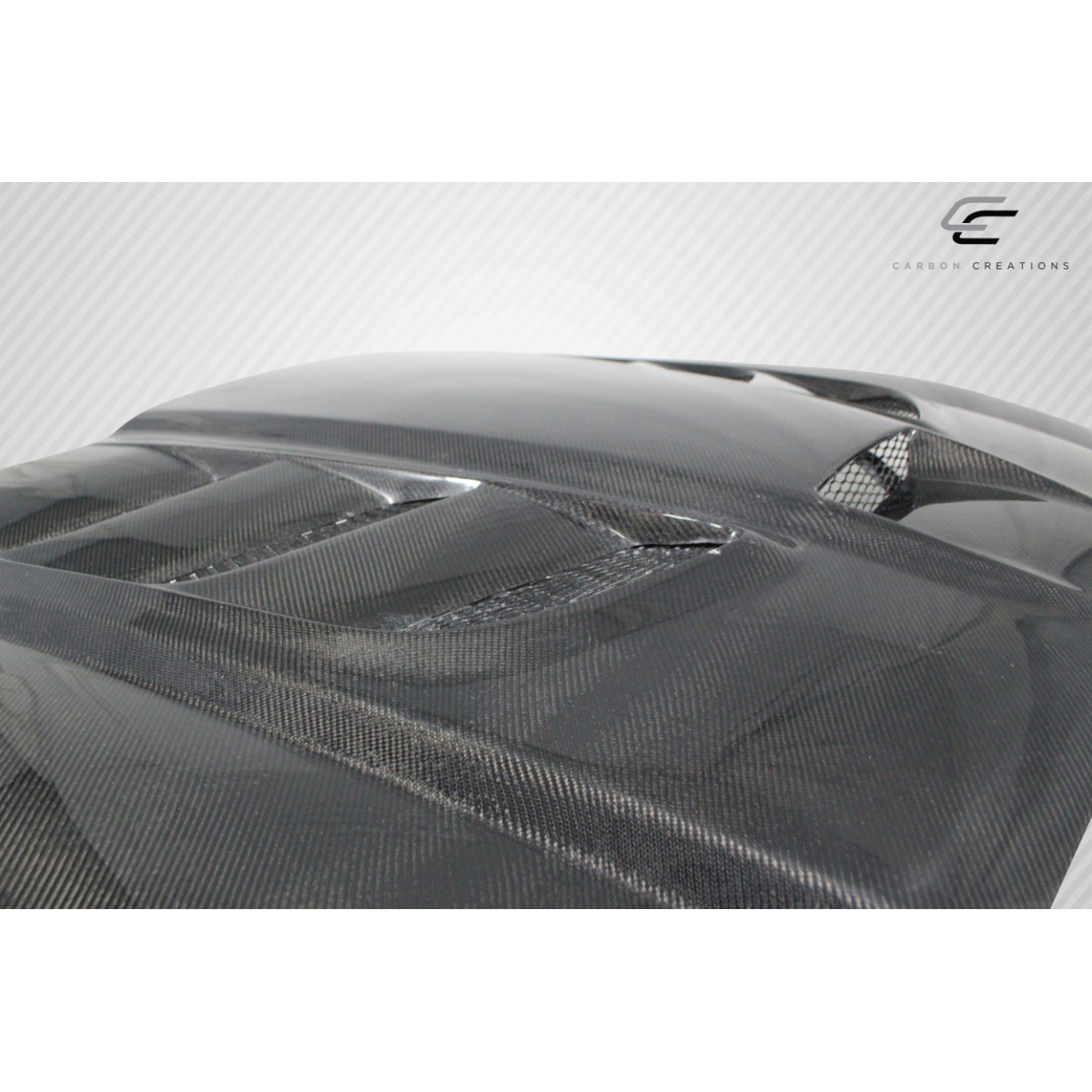 Modify your Dodge Charger 2011 with our Exterior/Hoods - Angled view showcasing carbon fiber texture and design