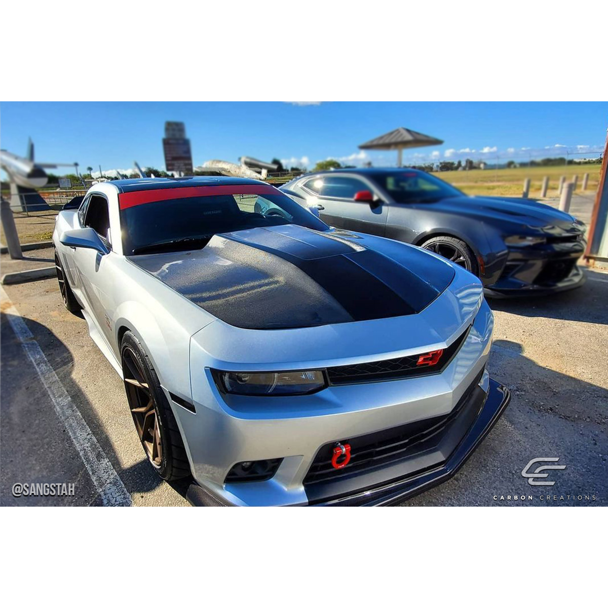 Modify your Chevrolet Camaro 2010 with our Exterior/Hoods - Front three quarter angle view of the vehicle