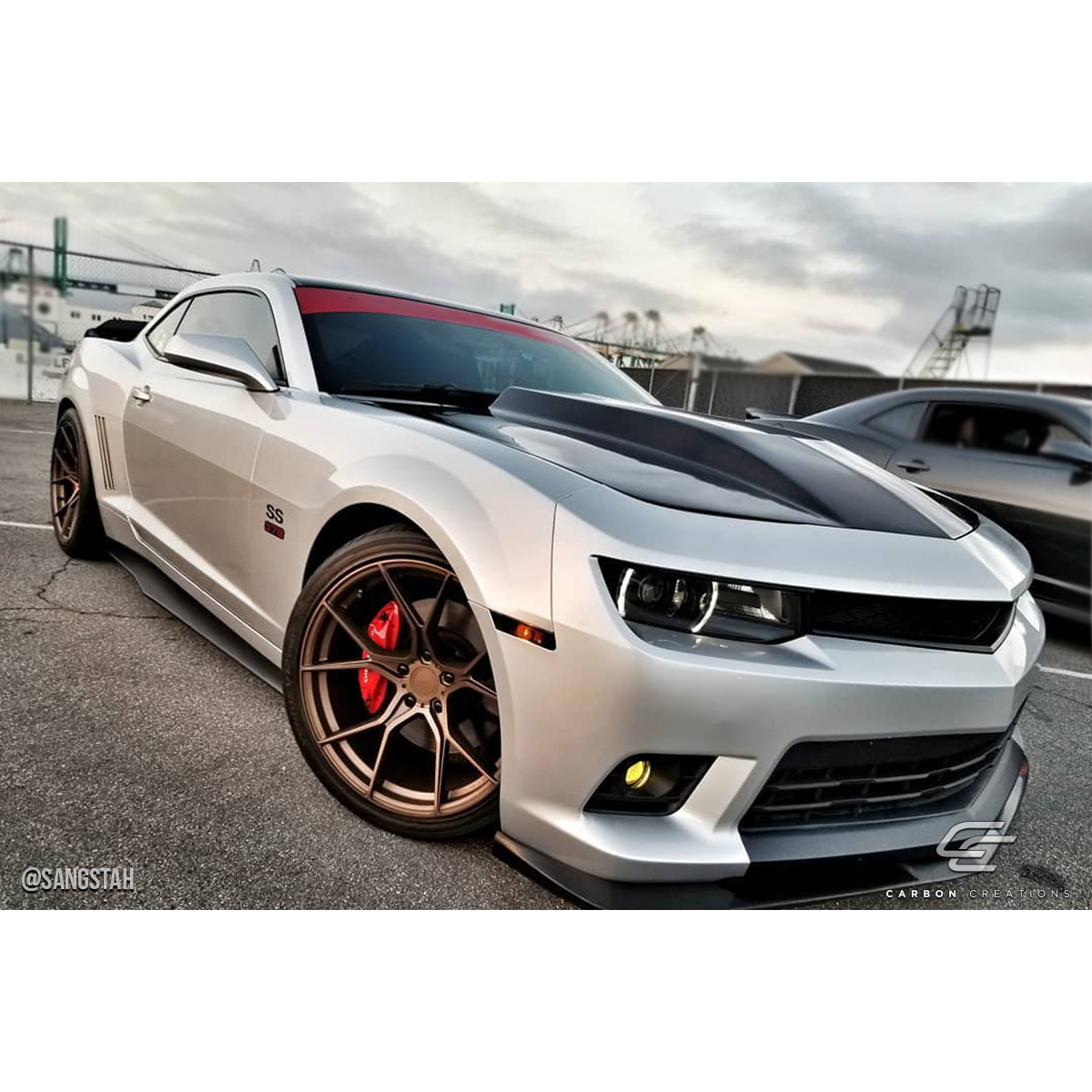 Modify your Chevrolet Camaro 2010 with our Exterior/Hoods - Low angle view highlighting hood details
