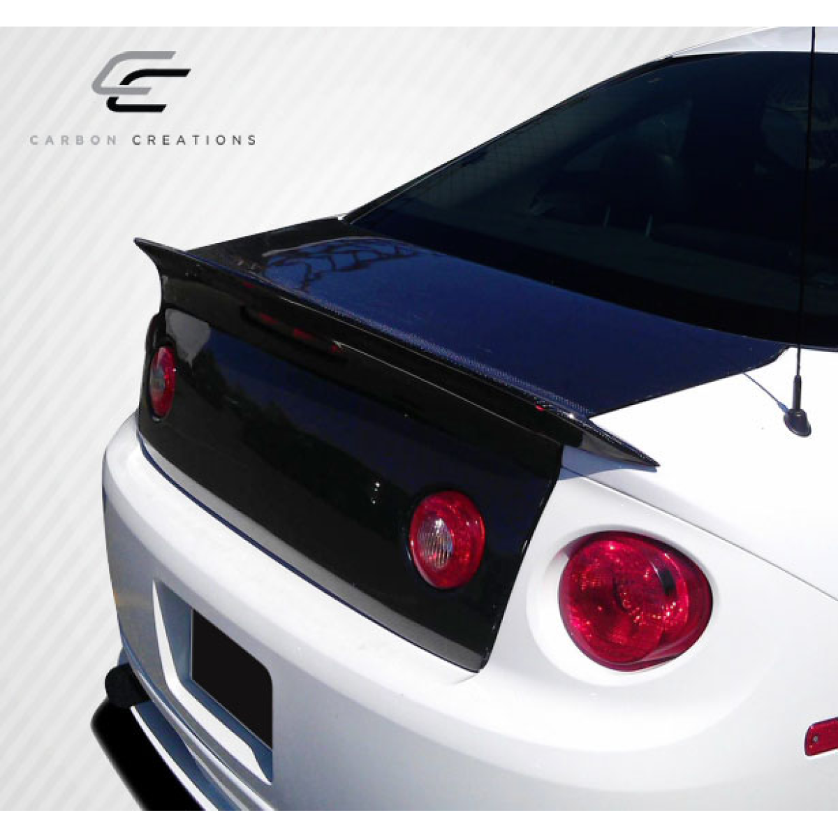 Modify your Chevrolet Cobalt 2005 with our Exterior/Trunks - Rear angle view of trunk with spoiler