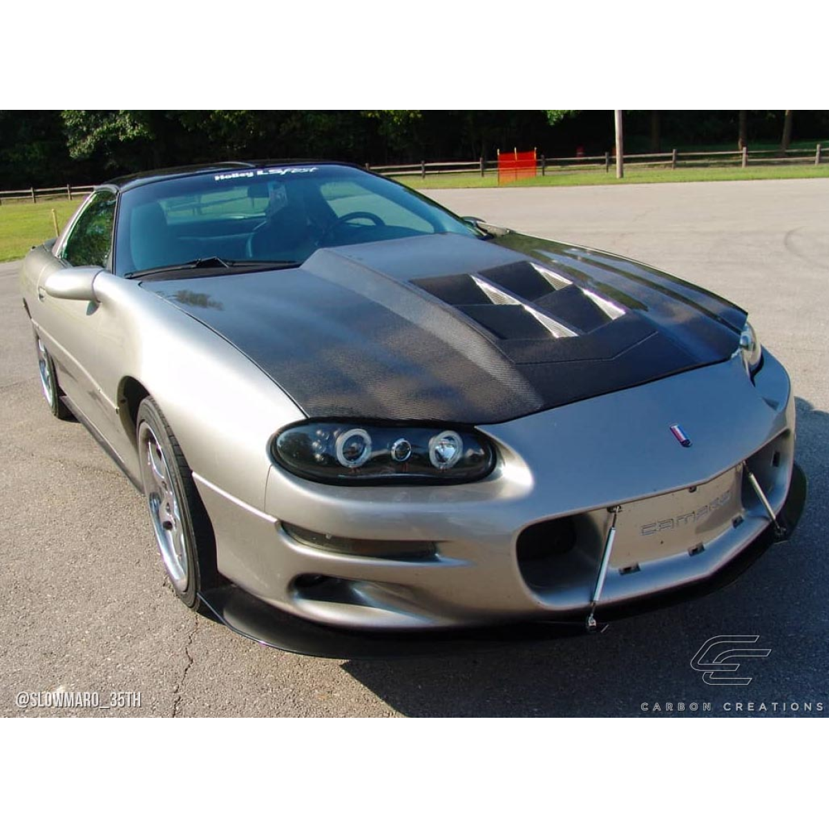 Modify your Chevrolet Camaro 1998 with our Exterior/Hoods - Angle shows front three quarter view of vehicle