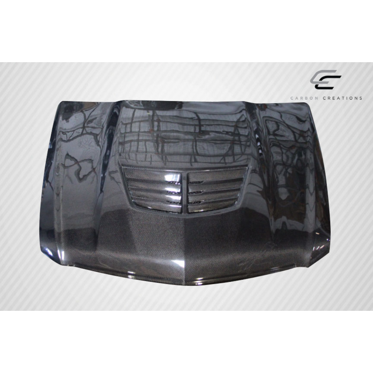 Modify your Cadillac CTS 2009 with our Exterior/Hoods - Top view of a carbon fiber hood