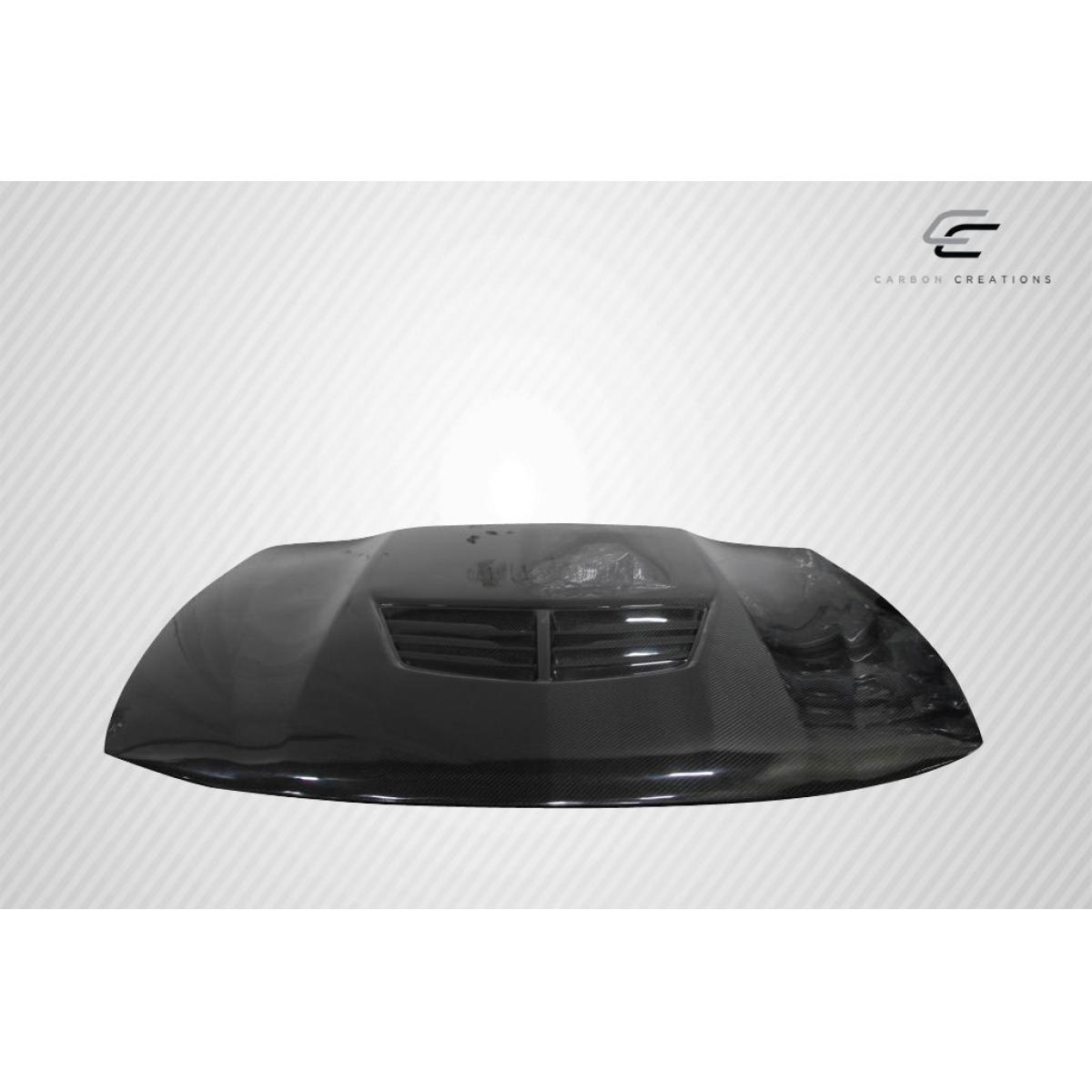 Modify your Pontiac GTO 2004 with our Exterior/Hoods - Angled view of a carbon fiber hood