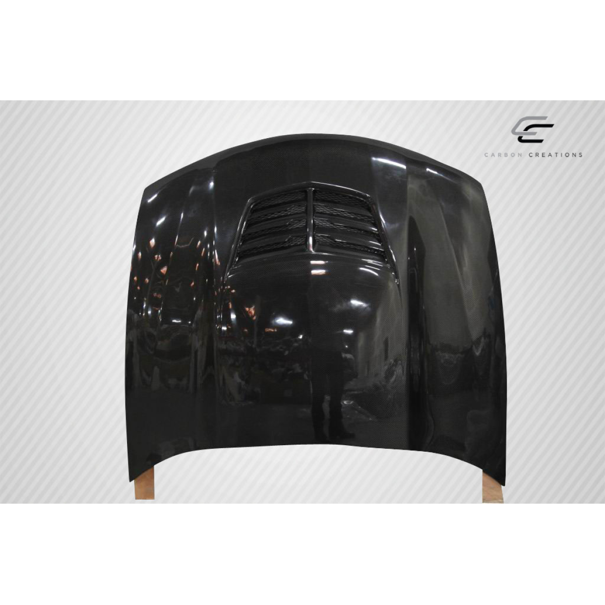 Modify your Pontiac GTO 2004 with our Exterior/Hoods - Front view of carbon fiber hood at slight angle