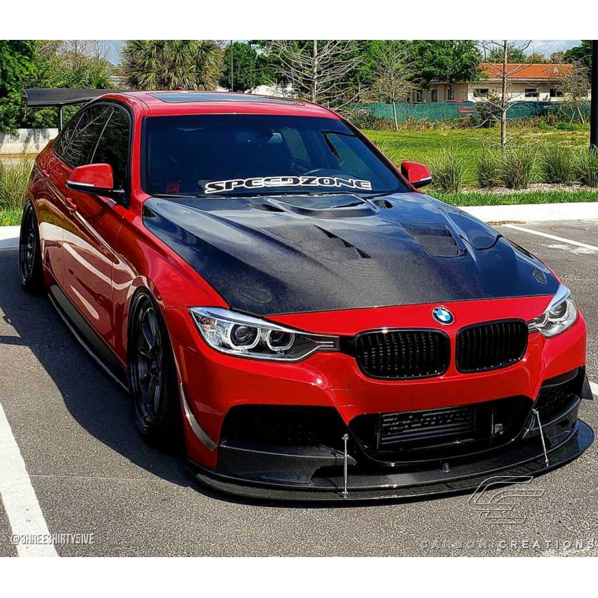 Modify your BMW 3-Series 2012 with our Exterior/Hoods - Front angled view showing sleek carbon fiber hood