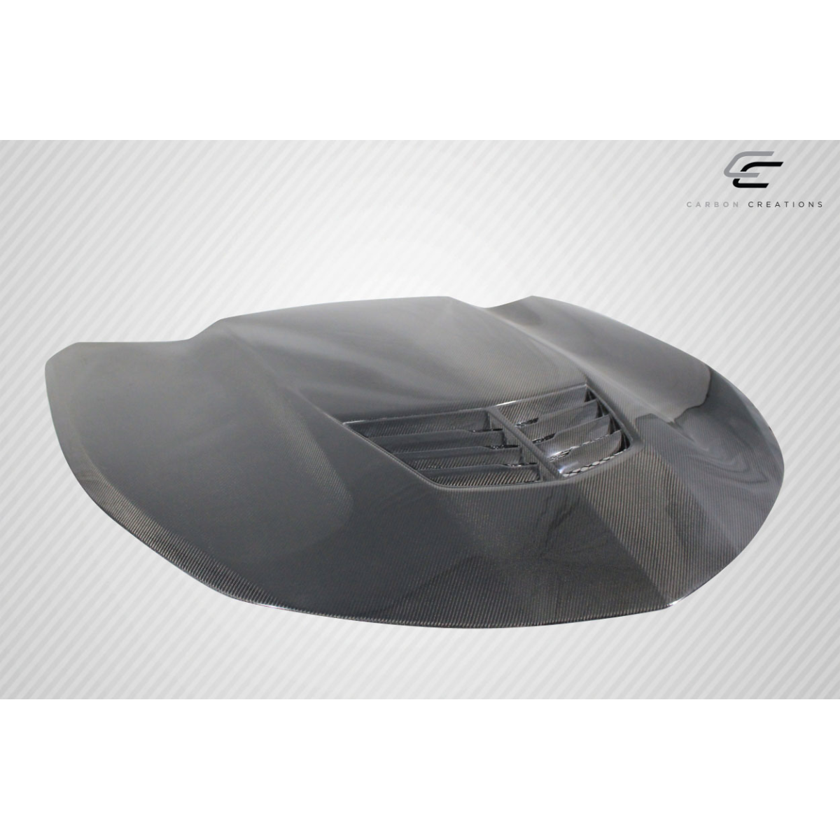 Modify your Chevrolet Camaro 2016 with our Exterior/Hoods - Angled view of a carbon fiber hood