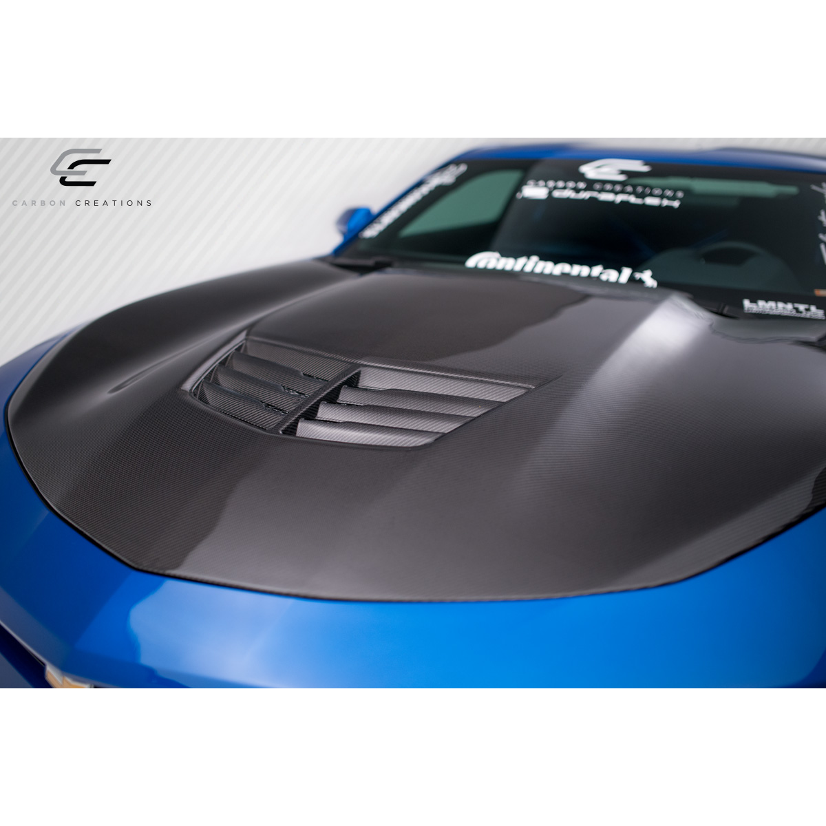 Modify your Chevrolet Camaro 2016 with our Exterior/Hoods - Top view of the carbon fiber hood at an angle