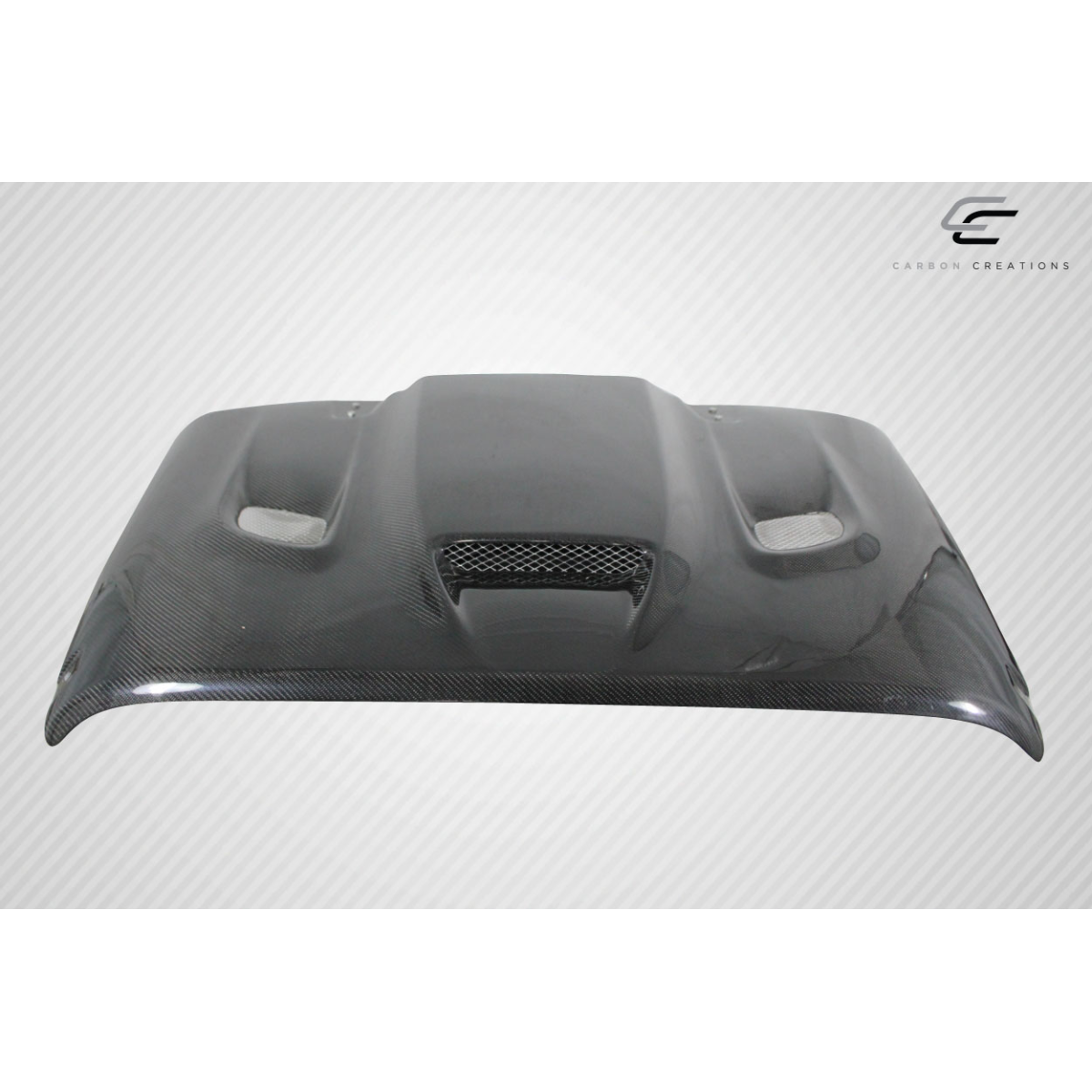 Modify your Jeep Wrangler 2007 with our Exterior/Hoods - Front view of a carbon fiber hood at a flat angle