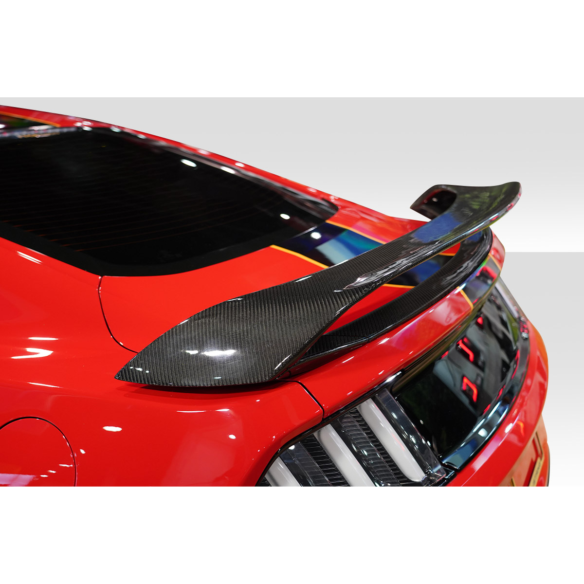 Modify your Ford Mustang 2015 with our Exterior/Wings - Angle view of rear wing on red mustang coupe
