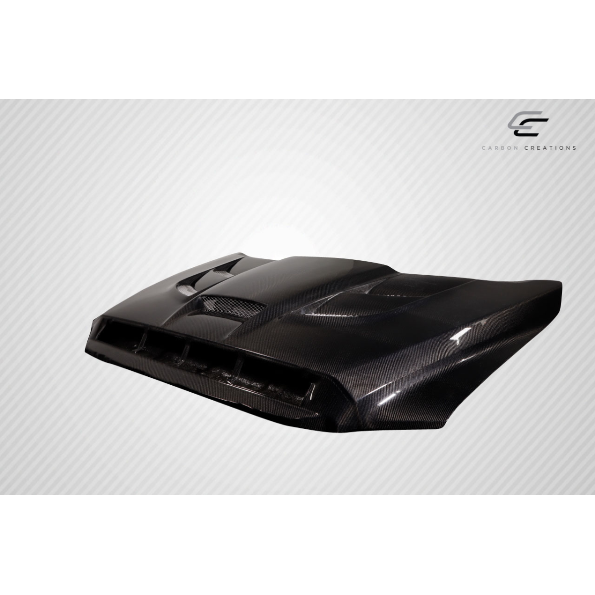 Modify your Toyota Tundra 2014 with our Exterior/Hoods - Angled view of carbon fiber hood part