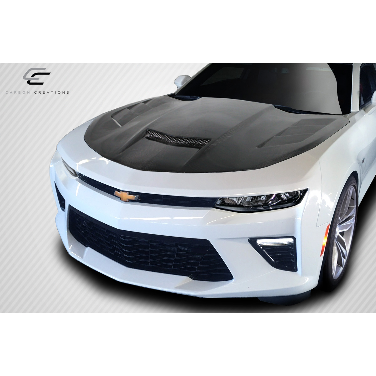 Modify your Chevrolet Camaro 2016 with our Exterior/Hoods - Front angle view of the carbon fiber hood