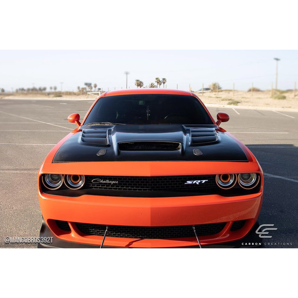 Modify your Dodge Challenger 2008 with our Exterior/Hoods - Front view of the vehicle from a low angle