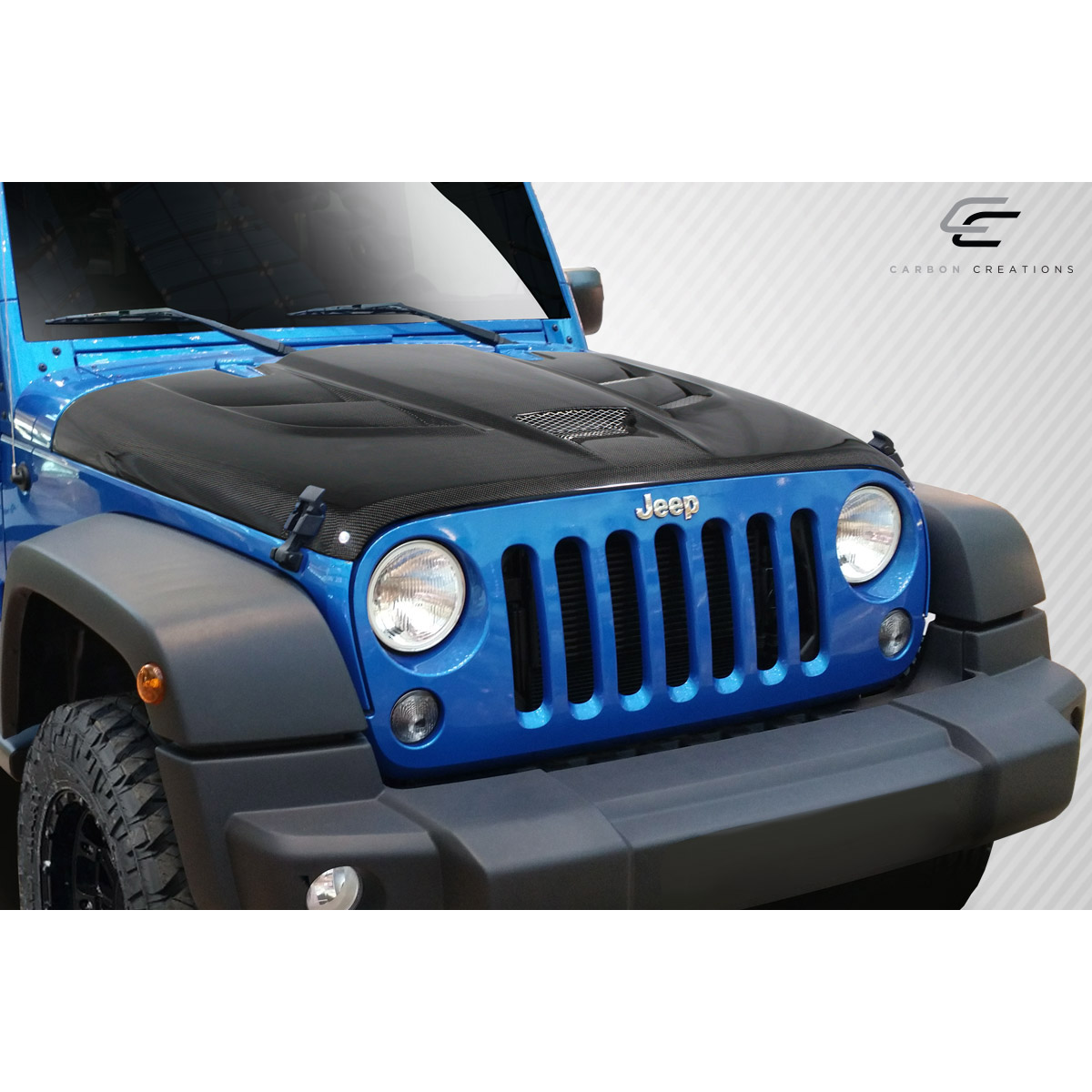 Modify your Jeep Wrangler 2007 with our Exterior/Hoods - Front view at a slight angle showcasing the hood