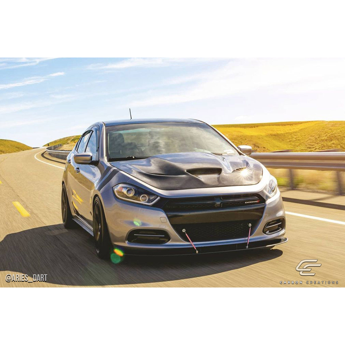 Modify your Dodge Dart 2013 with our Exterior/Hoods - Front angle view of Dodge Dart on the road