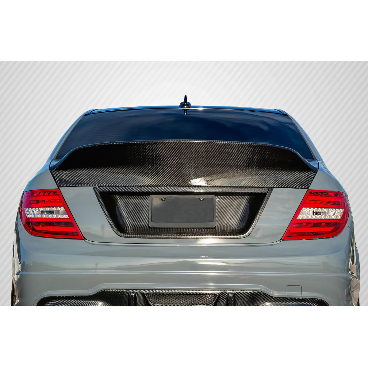 Modify your Mercedes-Benz C300 2008 with our Exterior/Wings - Rear angle with carbon fiber wing detail