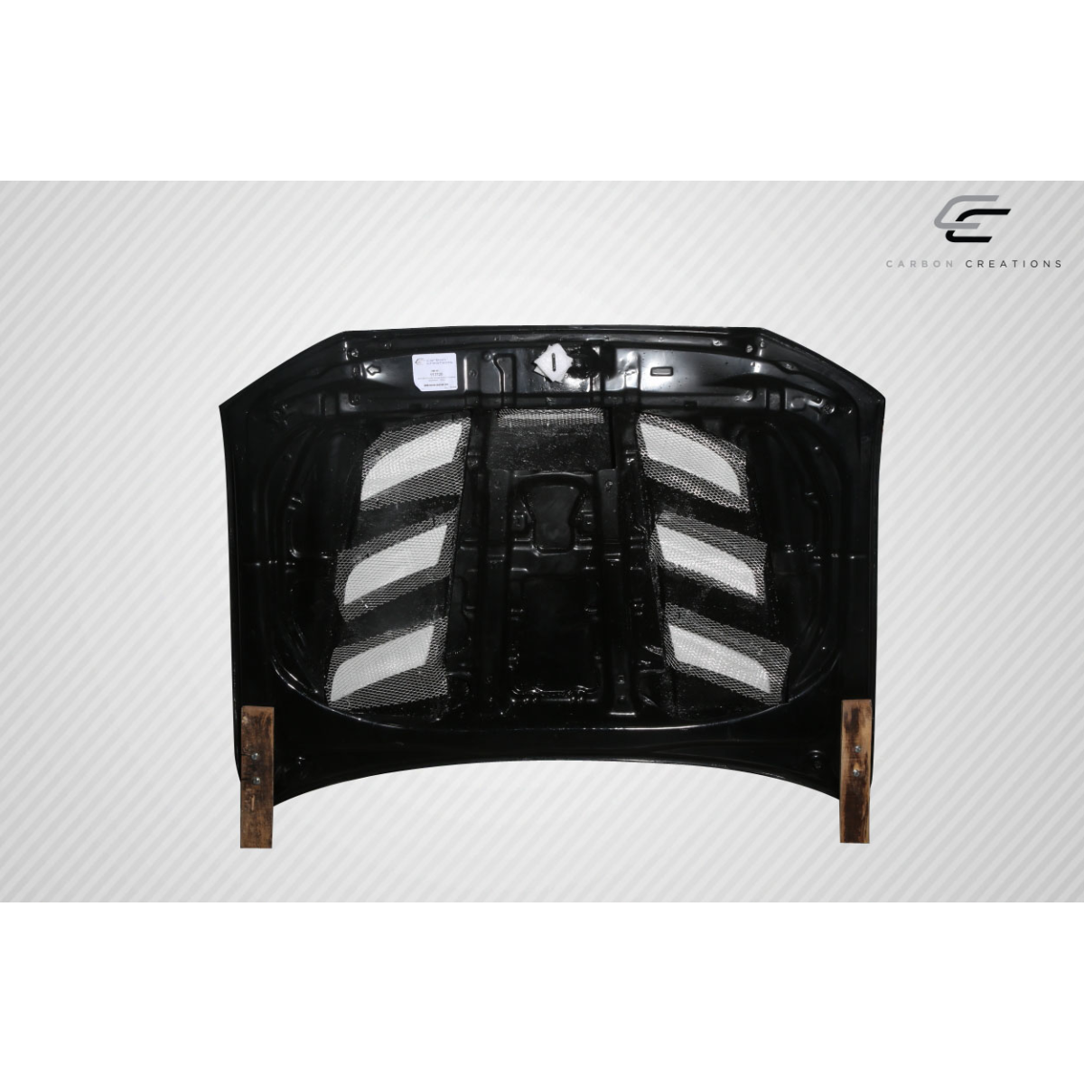 Modify your Toyota Tacoma 2012 with our Exterior/Hoods - Part is viewed from the front at an angle