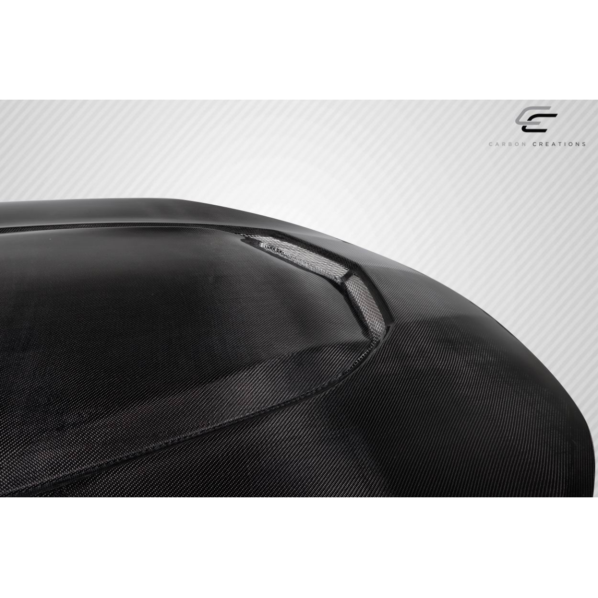 Modify your Chevrolet Camaro 2016 with our Exterior/Hoods - Angled view of a carbon fiber hood