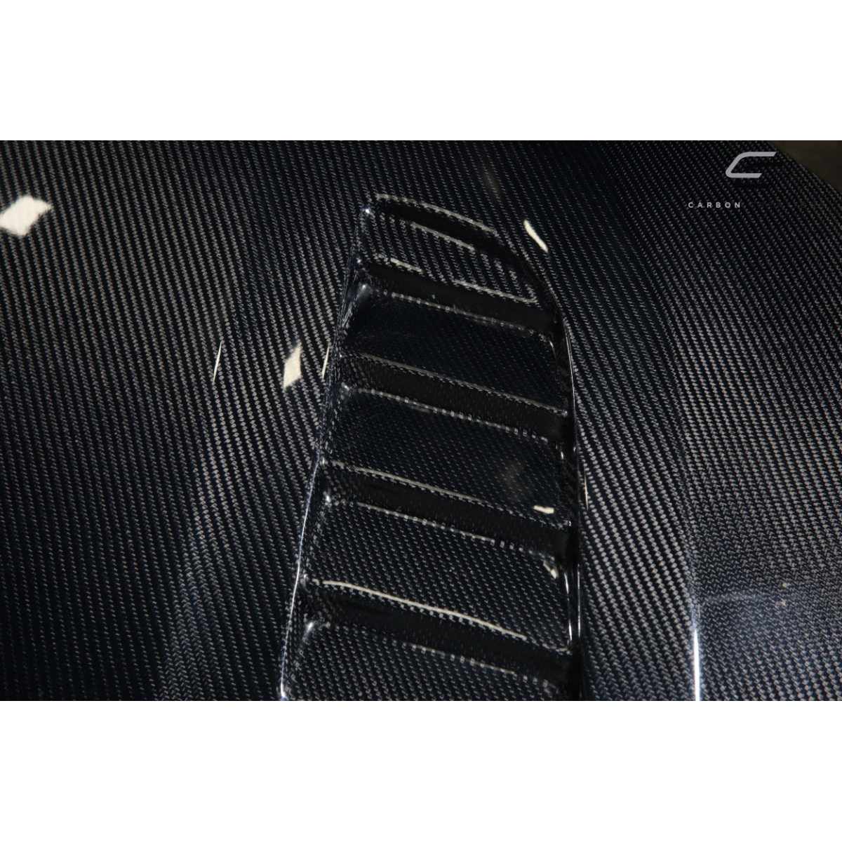 Modify your BMW 3-Series 2012 with our Exterior/Hoods - Top view at an angle showing carbon fiber texture