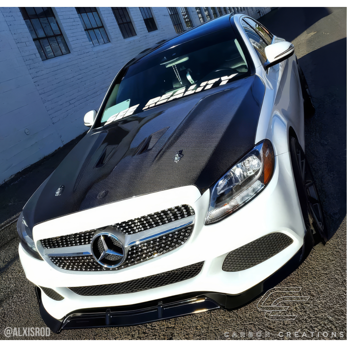 Modify your Mercedes-Benz C300 2015 with our Exterior/Hoods - Image shows a vehicle from a diagonal angle