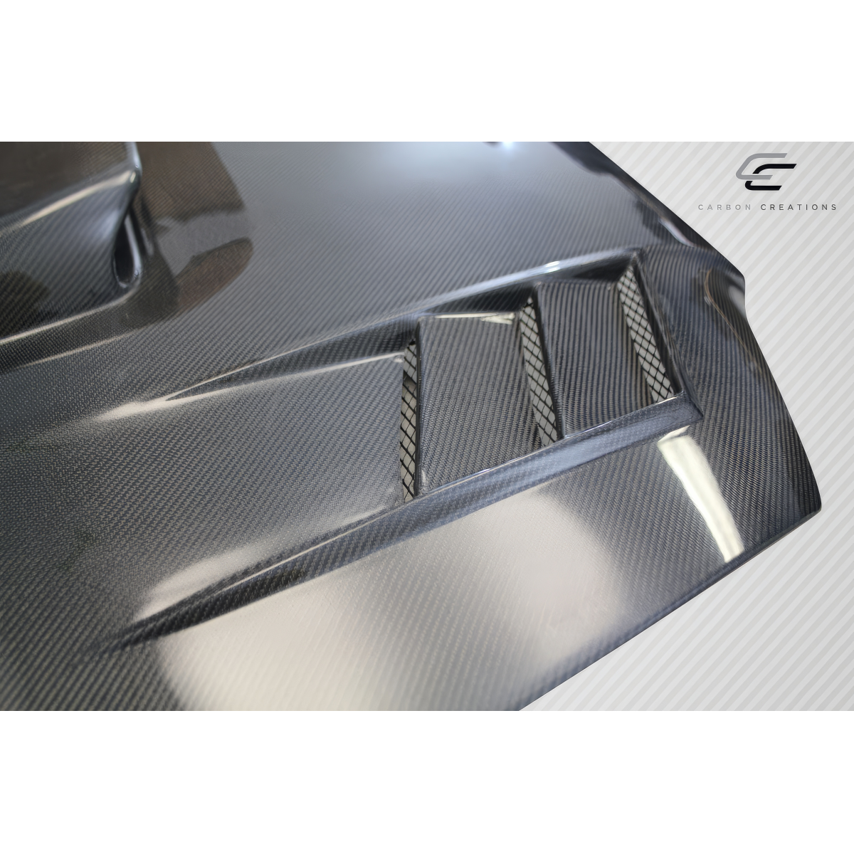 Modify your Subaru Impreza 2004 with our Exterior/Hoods - Angled view showcasing carbon fiber texture