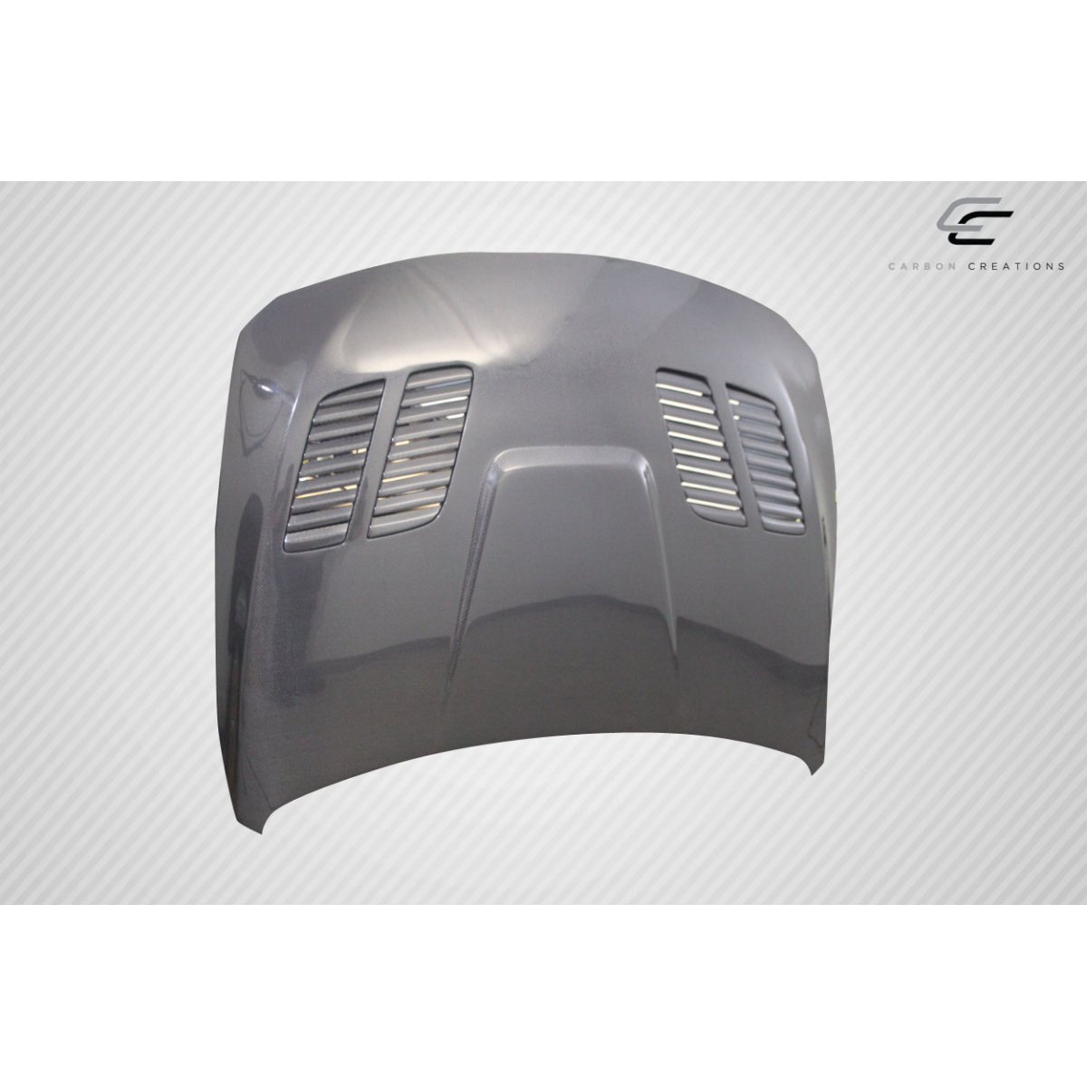 Modify your BMW 3-Series 2012 with our Exterior/Hoods - Angled view of a carbon fiber hood part