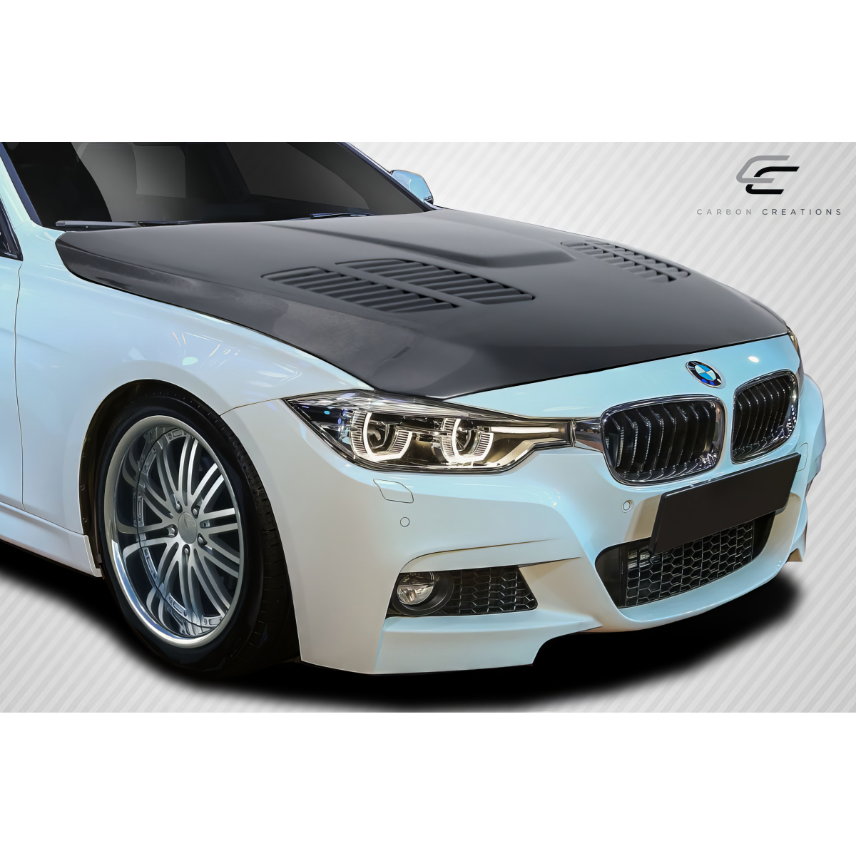 Modify your BMW 3-Series 2012 with our Exterior/Hoods - Front angle with focus on hood design and features