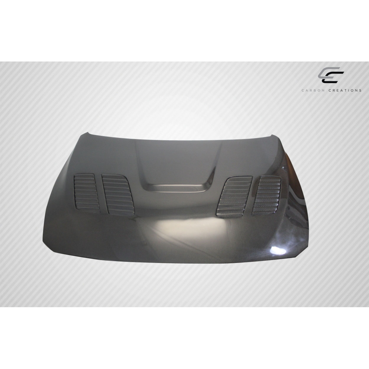 Modify your BMW 3-Series 2012 with our Exterior/Hoods - Front view of carbon fiber hood at slight angle