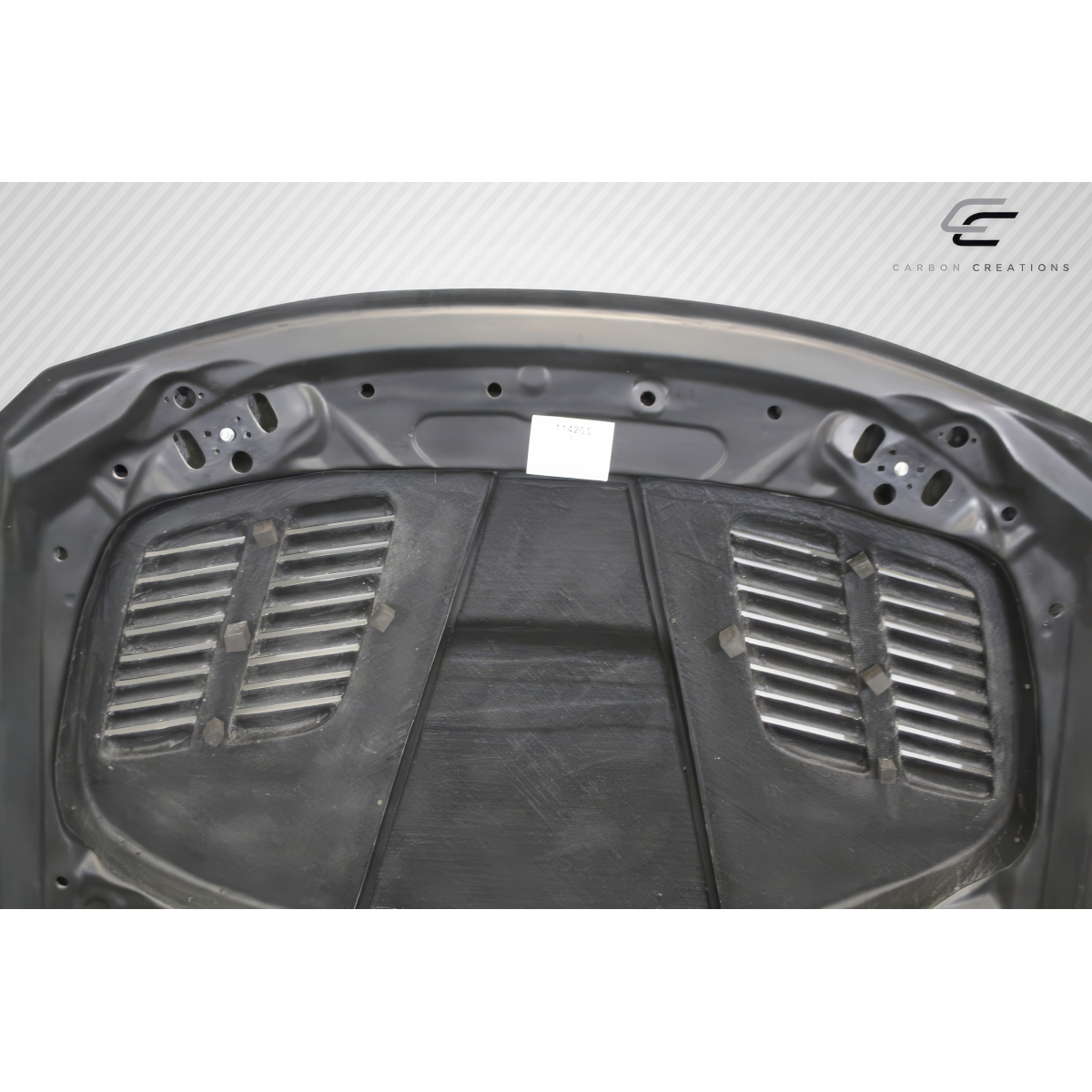 Modify your BMW 3-Series 2012 with our Exterior/Hoods - Top view of carbon fiber hood at a slight angle