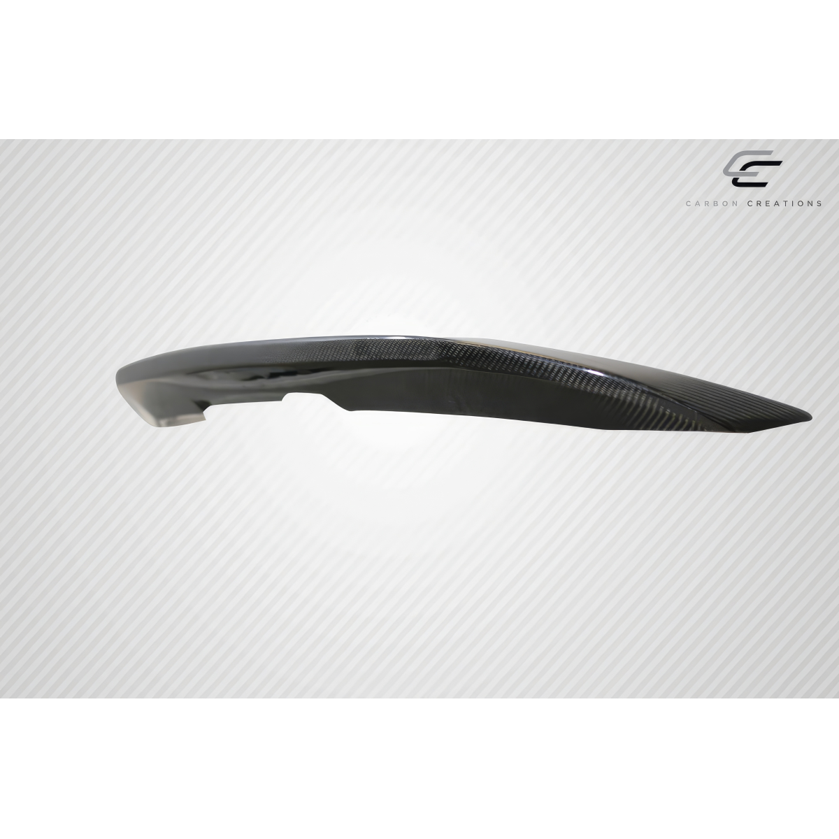 Modify your Ford Mustang 2010 with our Exterior/Wings - Angled view of a carbon fiber wing spoiler